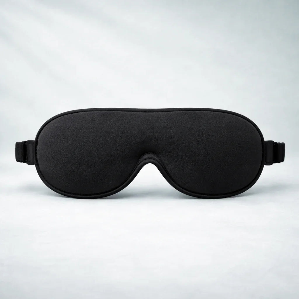 Restology DeepDark 3D contoured blackout sleep mask with memory foam and zero-pressure eye cavities for total darkness and REM sleep.