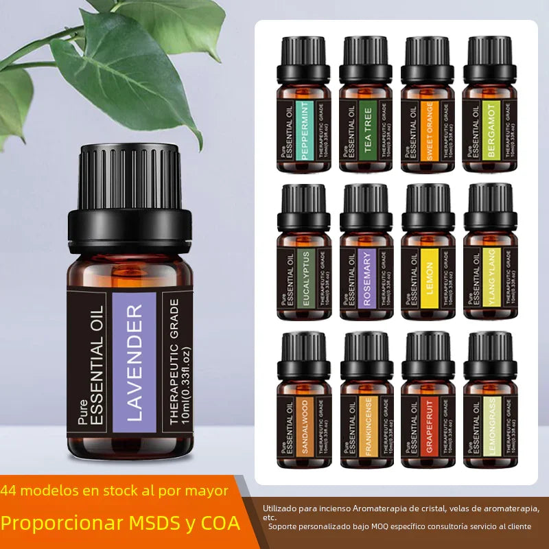 Twelve dark amber essential oil bottles with black caps and colorful labels, including lavender, peppermint, and eucalyptus.