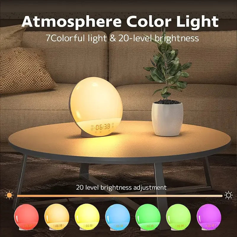Oval-shaped sunrise alarm clock glowing warm yellow on round wooden table beside green potted plant in living room setting.